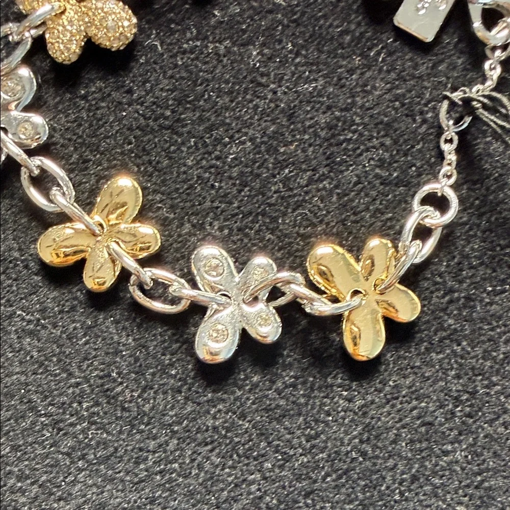 Coach Two-Tone Floral Charm Bracelet in Gold and Silver